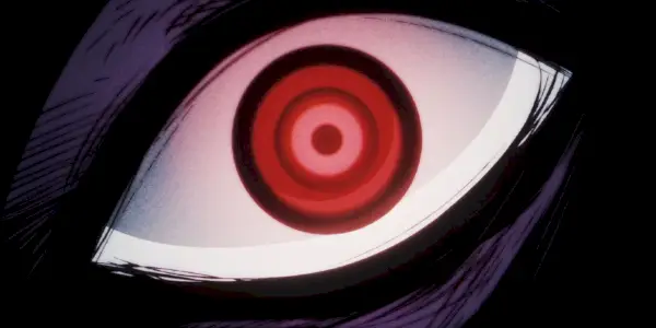 primo piano intimidatorio di un occhio rosso appartenente a Imu in One Piece