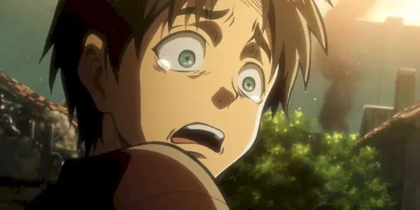 Ein junger Eren hat große Angst, als er in Attack on Titan sieht, wie seine Mutter unter den Trümmern gefangen ist