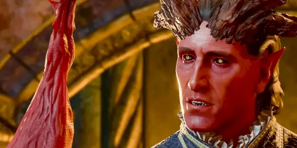 Raphael a metà frase nella sua forma cambion, con le corna e la pelle rossa, in uno screenshot di Baldur