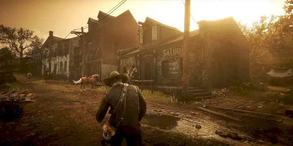 Artur idący w stronę swojego konia w Van Horn w grze Red Dead Redemption 2.