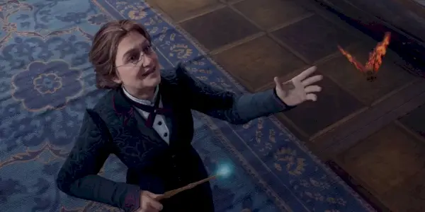 Obraz profesor Weasley wyciągającej rękę do motyla w powietrzu, a jej różdżka świeciła na niebiesko.