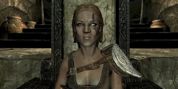 דיוקן של איולה יושבת על כיסא בעל גב גבוה ב-Skyrim.