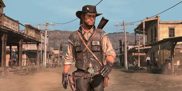 John Marston slentrer ned ad en vestlig hovedgade i Red Dead Redemption.