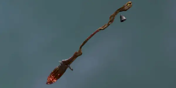 En gengivelse af Wild Fire Broom i Hogwarts Legacy mod en grå baggrund.