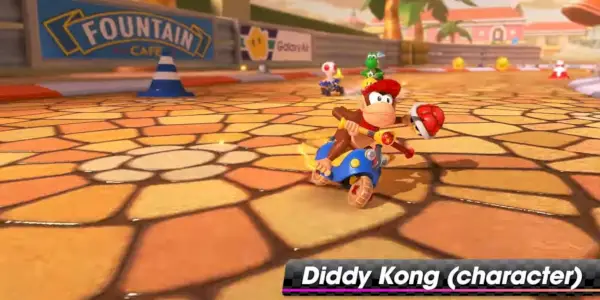 Diddy Kong dirigindo uma bicicleta azul Mario Kart 8 Deluxe DLC.