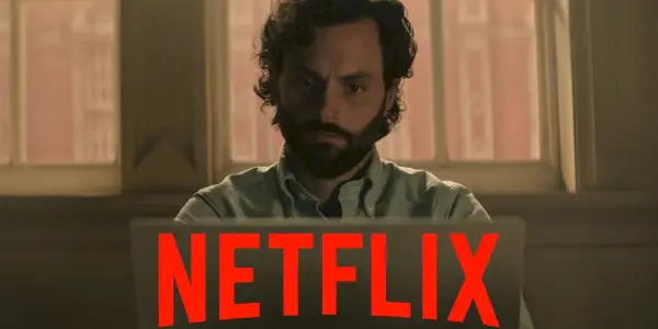 Joe Goldberg de Vous regardez un ordinateur avec le logo Netflix