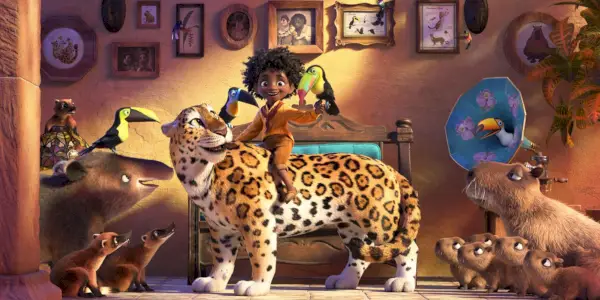 Antonio trzyma ptaka i jeździ na jaguarze w otoczeniu innych zwierząt w Disneyu