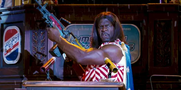 총을 든 드웨인 엘리존도 마운틴 듀 허버트 카마초 역의 이디오크라시 테리 크루스(Idiocracy Terry Crews)