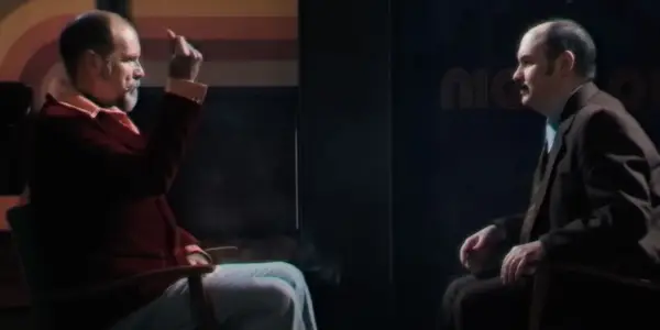 Carmichael the Conjurer (Ian Bliss) hypnotizes Gus (Rhys Auteri) in Late Night with the Devil