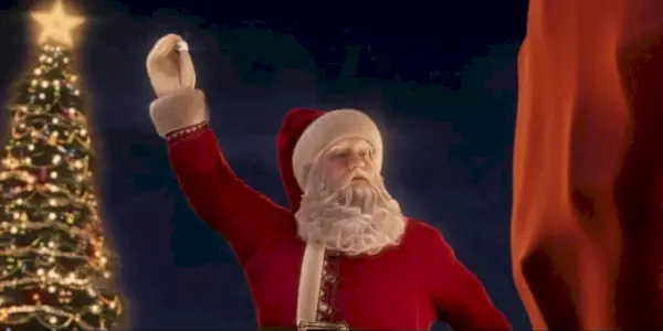 Santa zvedne svůj zvon na saních v Polárním expresu