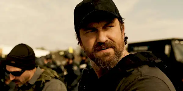 Big Nick regarde par-dessus son épaule avec une expression de colère dans Den of Thieves