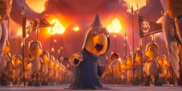 Kevin Michael Richardson como Kamek está na frente de uma multidão no filme Super Mario Bros.