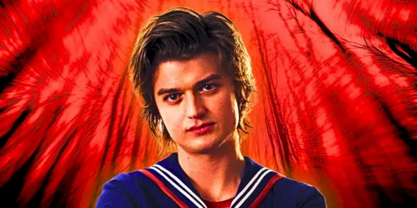 Joe Keery als Steve Harrington trägt seine Scoops-Ahoy-Uniform in „Stranger Things“ vor rotem Hintergrund