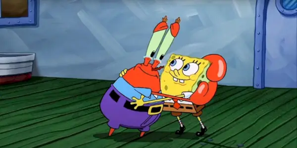Pán Krabs objímajúci SpongeBob so slzami v očiach vo filme SpongeBob