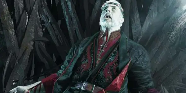 Maegor the Cruel on the Iron Throne with a blade through his neck.