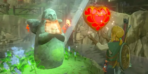 Link debout devant la statue de la Déesse et tenant un récipient de cœur dans Breath of the Wild