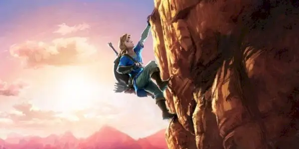 Lien escaladant une falaise dans une image promotionnelle de The Legend of Zelda : Breath of the Wild.