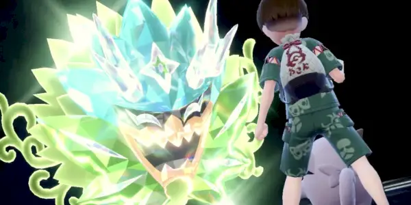 Trener Pokémonów z Clefairy walczący z Ogerponem Terastallizowanym za pomocą Turkusowej Maski.