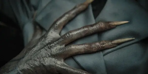 A monstrous hand touching Margaret